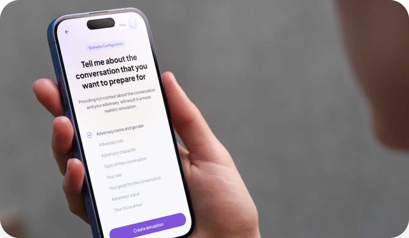 A hand holding a phone running the Convrsy scenario configuration screen